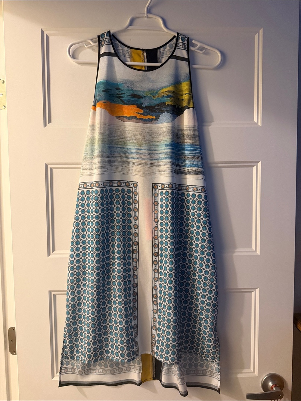 Clover Cannon sleeveless dress with neutral colors. The dress flows nicely!